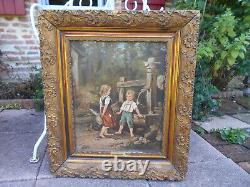 Large ancient oil painting / canvas of children by a well fountain signed Doria in a golden frame