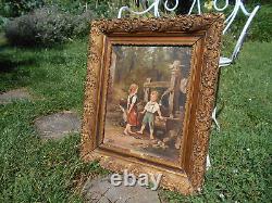 Large ancient oil painting / canvas of children by a well fountain signed Doria in a golden frame