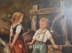 Large ancient oil painting / canvas of children by a well fountain signed Doria in a golden frame