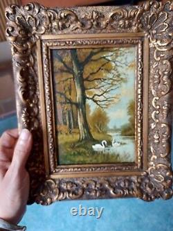 Old late 19th century landscape painting with swans