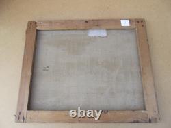 Old oil painting on canvas of a seascape with boats on a stormy coast, 19th century.