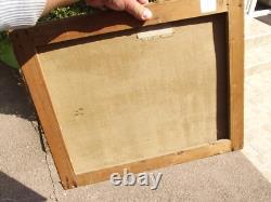 Old oil painting on canvas of a seascape with boats on a stormy coast, 19th century.