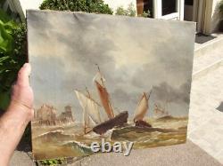 Old oil painting on canvas of a seascape with boats on a stormy coast, 19th century.