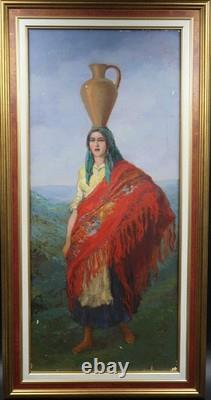 Old oil painting on canvas of a water carrier with the red shawl, Portugal
