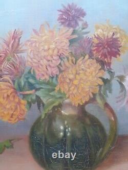 Old oil painting on canvas with chrysanthemums in a green pitcher signed and dated