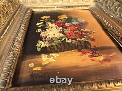 Old oil painting on wood, flower bouquet in wooden and plaster frame