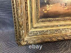 Old oil painting on wood, flower bouquet in wooden and plaster frame
