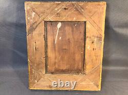 Old oil painting on wood, flower bouquet in wooden and plaster frame
