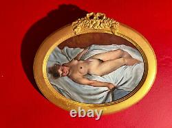 Old painting, female nude scene with its golden frame and pediment