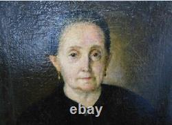 Old painting on canvas Portrait of a woman. 19th century
