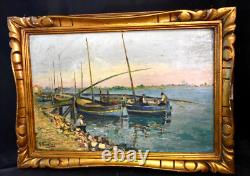 Translation: Old oil painting of a seascape with fishing boats, signed Ramirez, early 20th century.