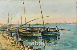 Translation: Old oil painting of a seascape with fishing boats, signed Ramirez, early 20th century.