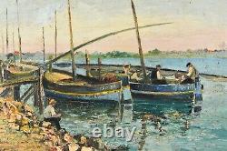 Translation: Old oil painting of a seascape with fishing boats, signed Ramirez, early 20th century.