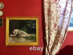 Ancienne huile sur toile du XXe siècle représentant un nu féminin, cadre doré