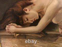 Ancienne huile sur toile du XXe siècle représentant un nu féminin, cadre doré