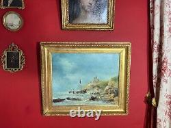 Ancienne huile sur toile signée représentant une marine animée, cadre doré