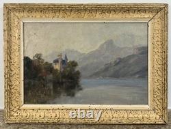 Château romantique au bord d'un lac alpin huile sur toile paysage ancien