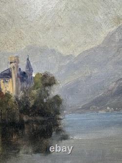 Château romantique au bord d'un lac alpin huile sur toile paysage ancien
